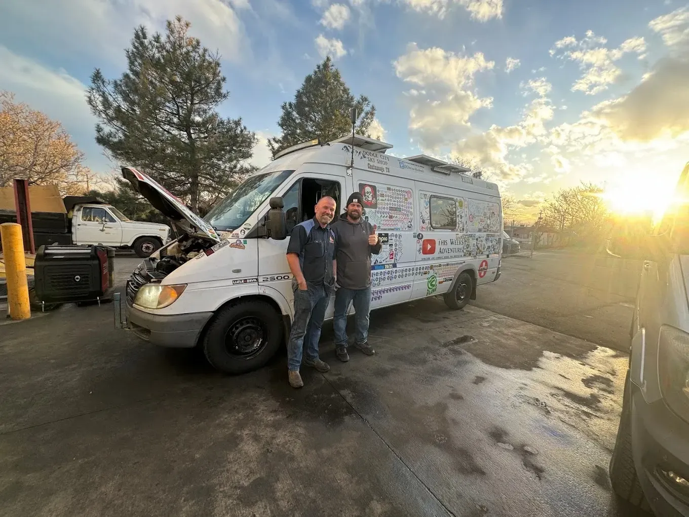 Colorado Fleetworks lead mechanic with van in shop entrance