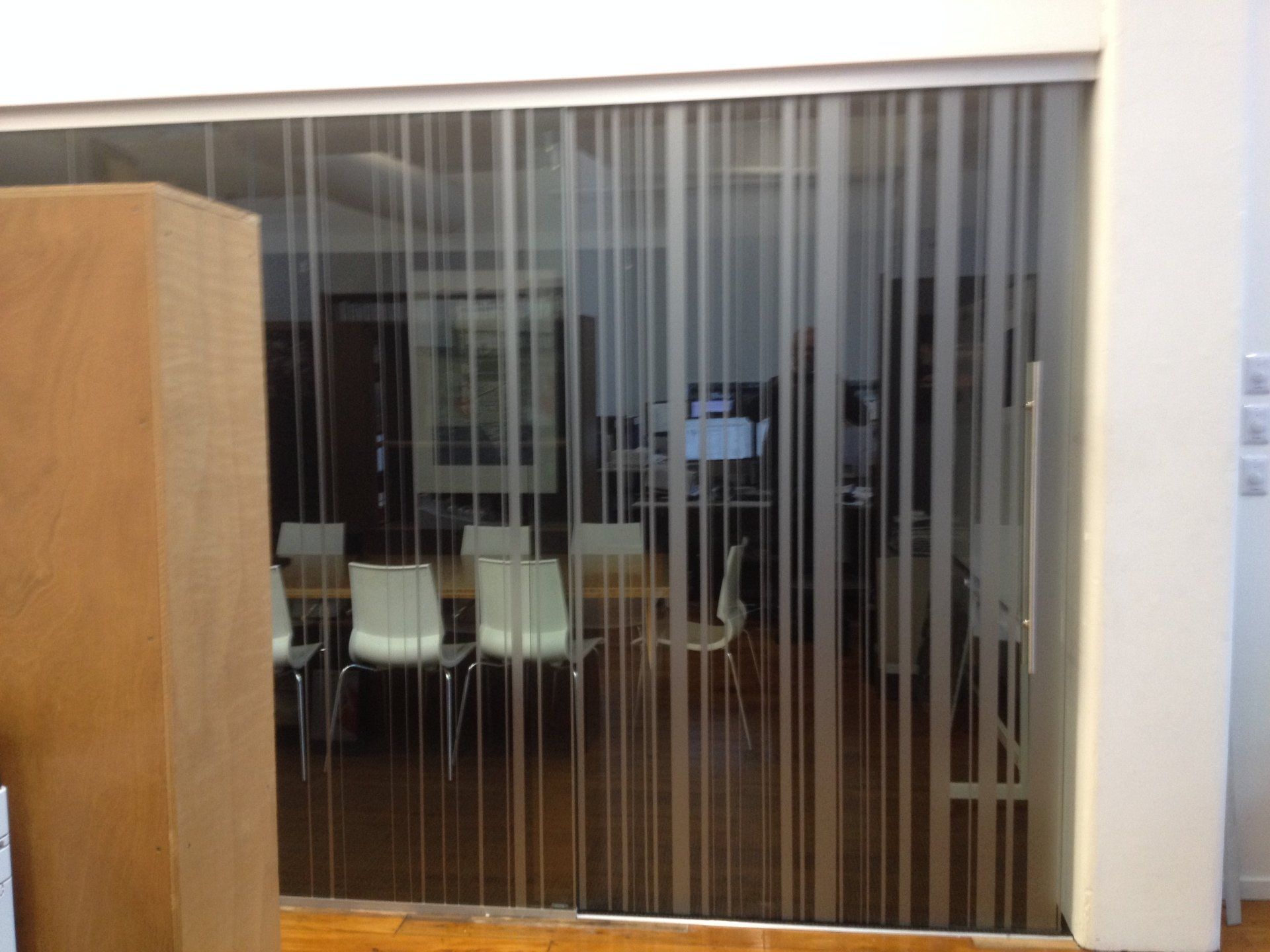 Window etch film vertical strips applied to meeting room windows