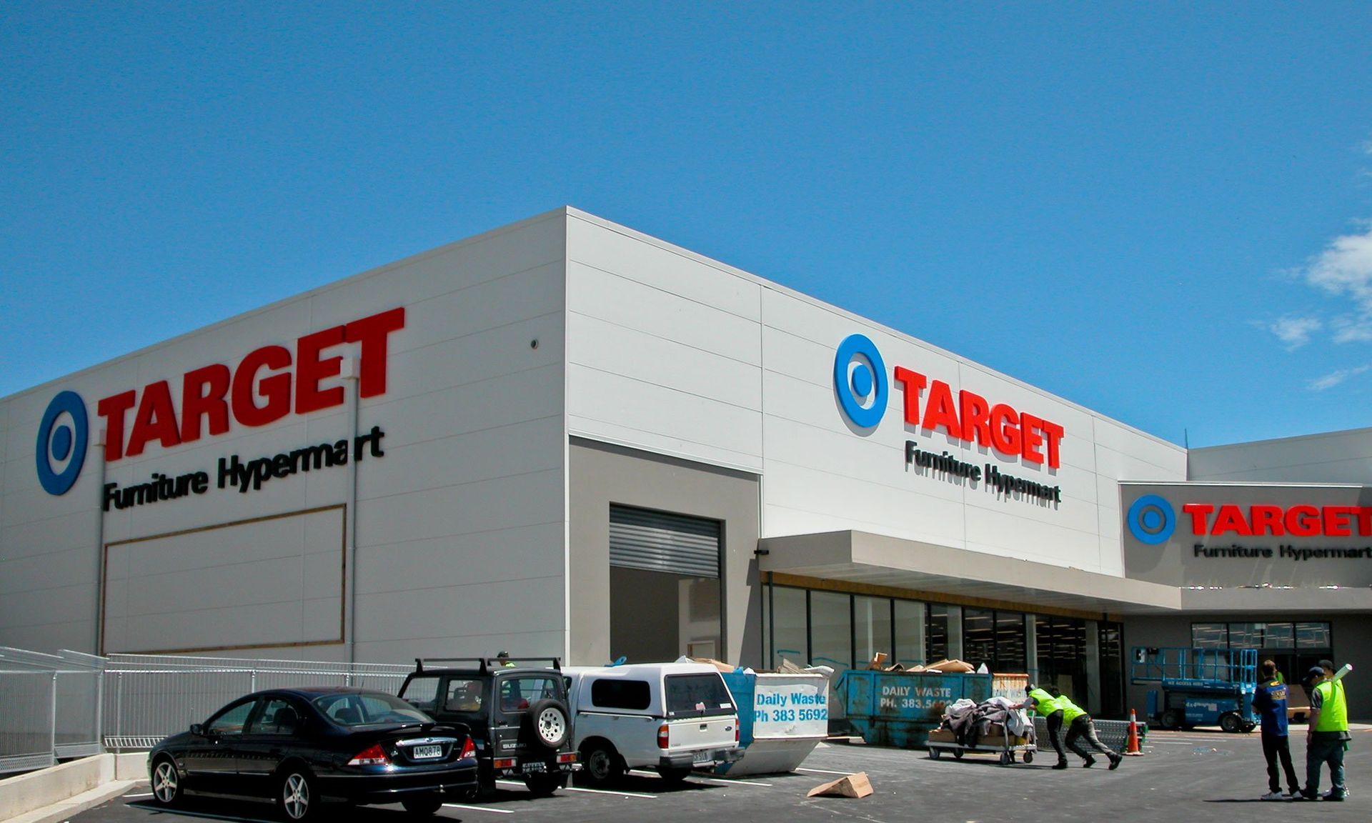 100mm thick painted polystyrene lettering and logos installed onto exterior of building
