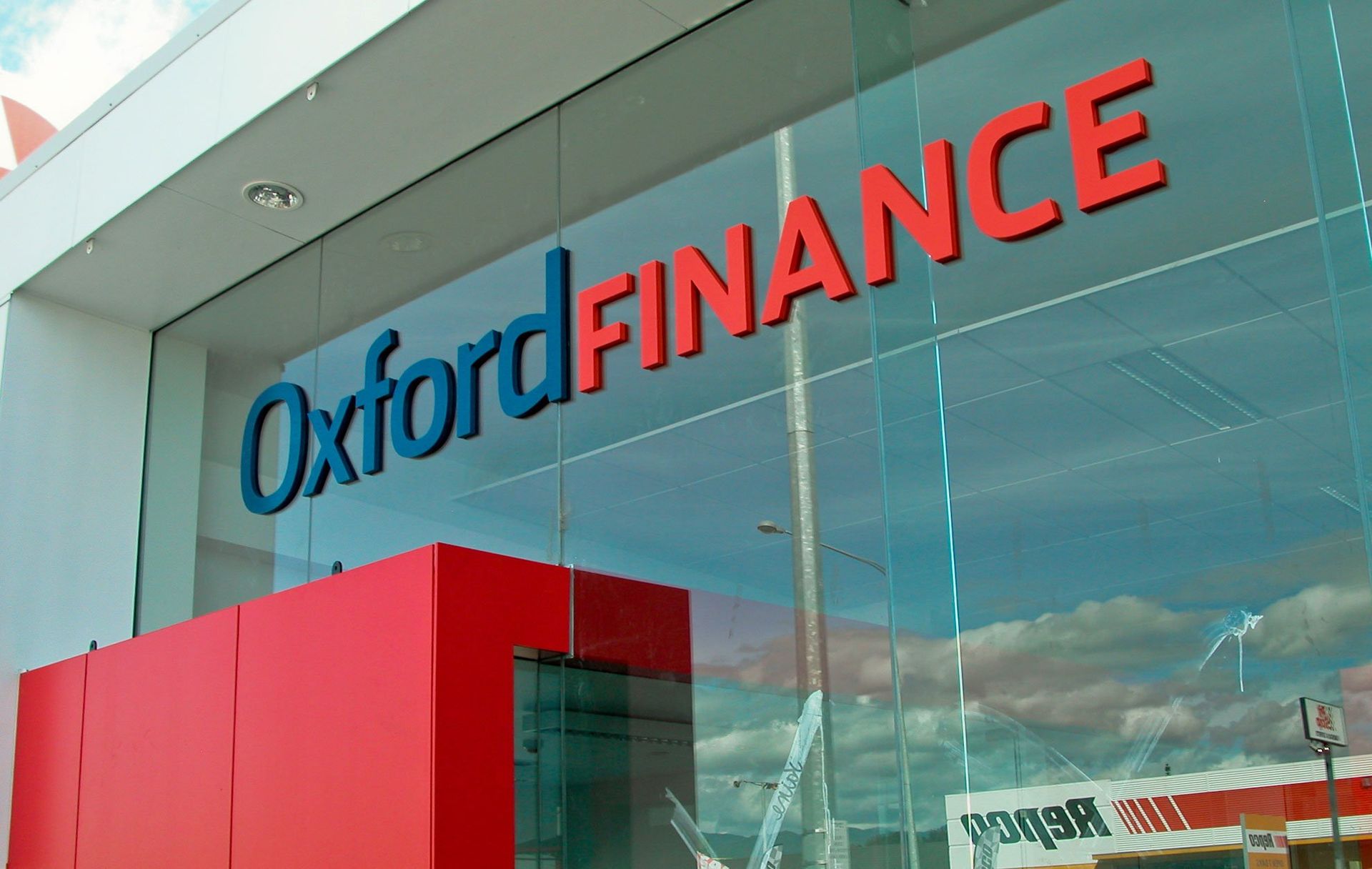20mm thick laser cut spray painted acrylic lettering and installed directly onto exterior glazing