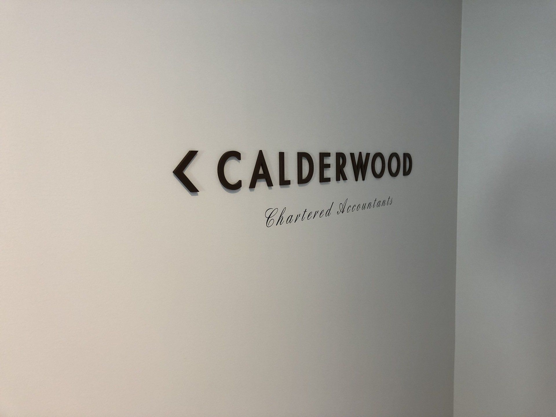 3D office foyer signs  laser cut, spray painted acrylic letters with computer cut vinyls applied directly to foyer wall