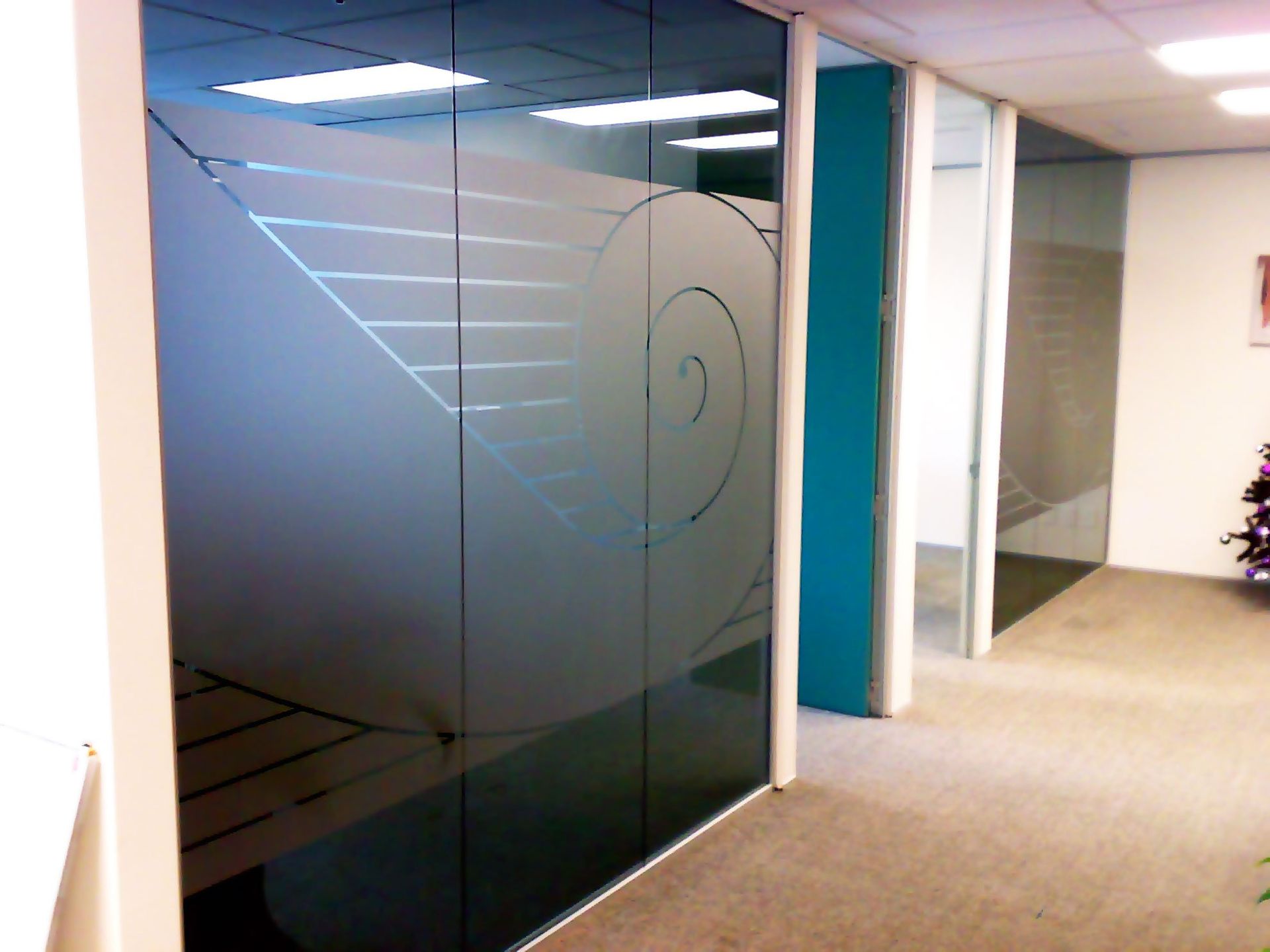 Window etch film with graphic design applied to office windows