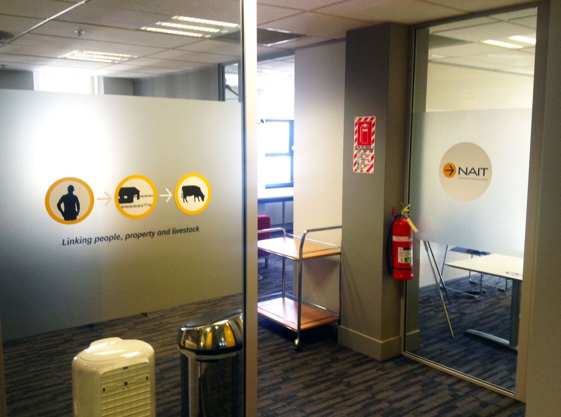 Window etch film with graphic design applied to office windows