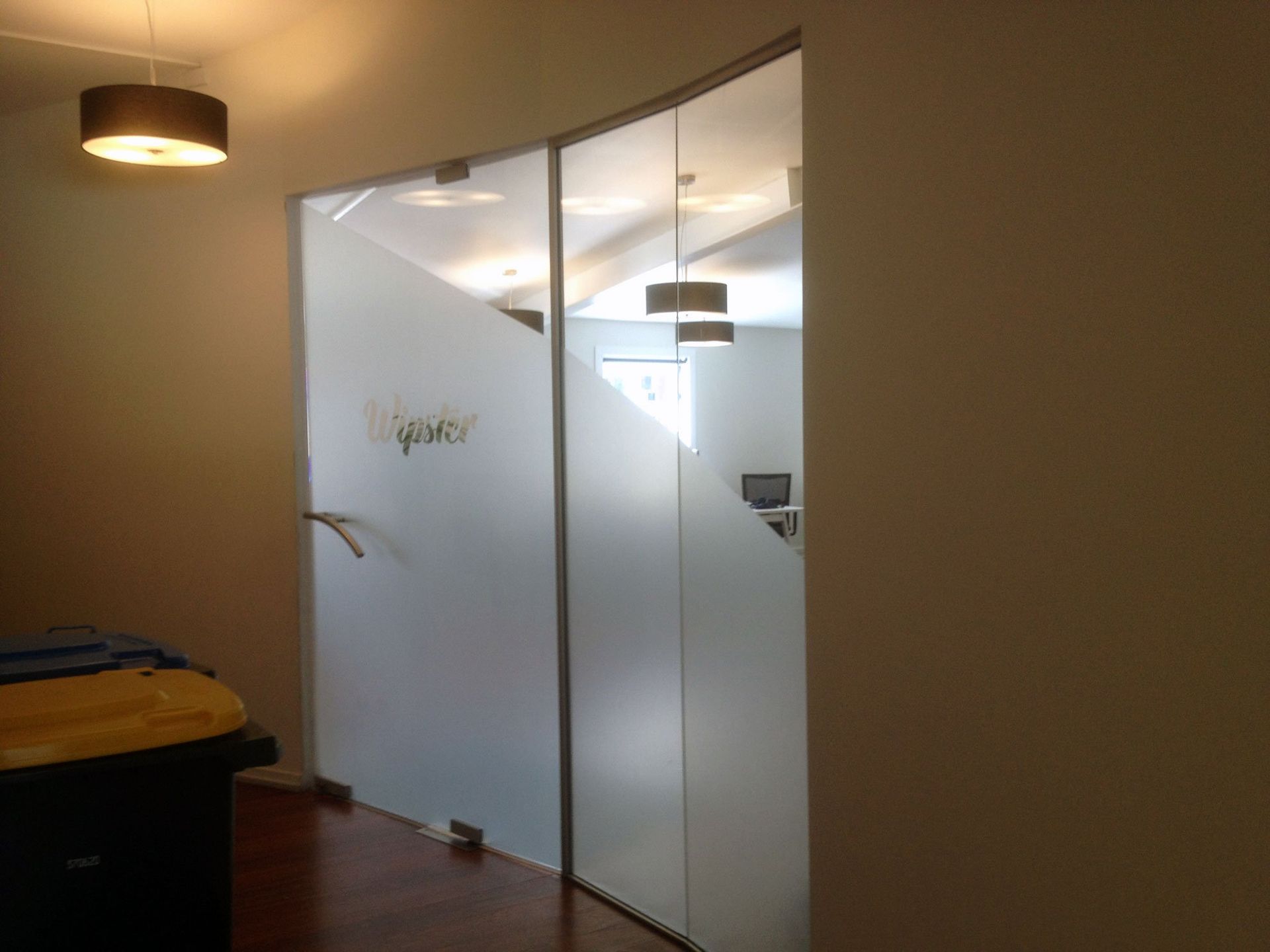 Window etch film with logo design applied to office windows