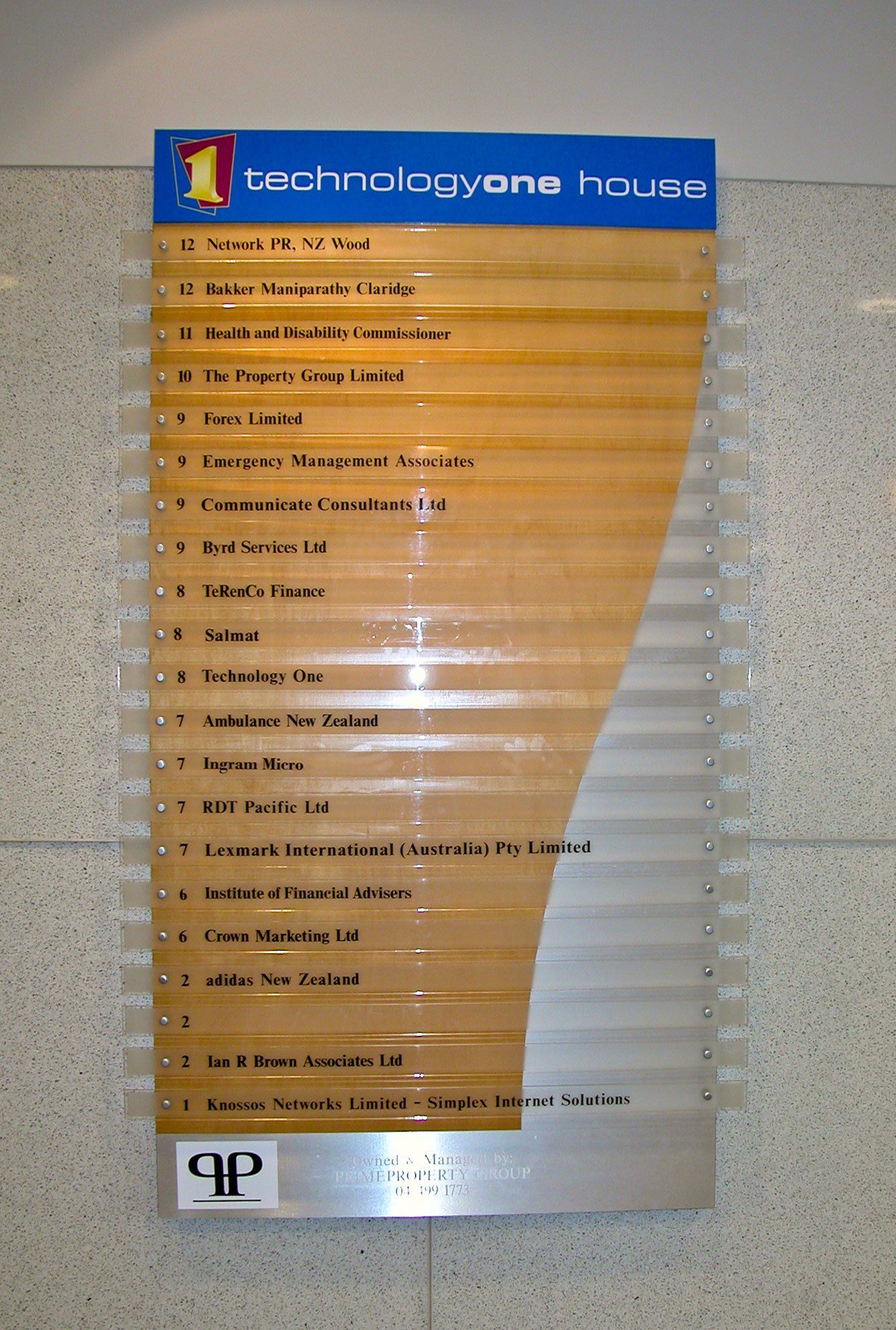 Computer cut vinyl lettering applied to clear acrylic directory panels