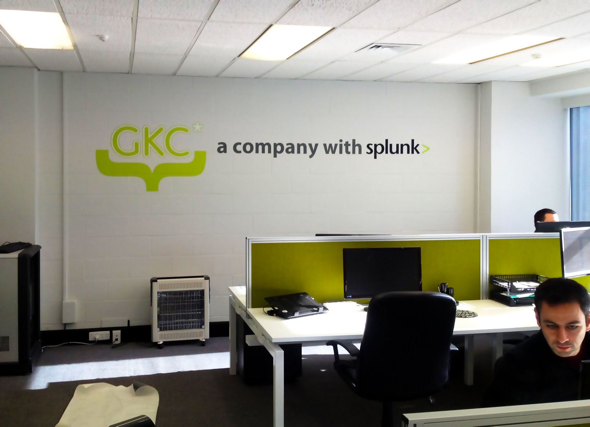 Computer cut vinyl lettering and logo applied to internal office wall