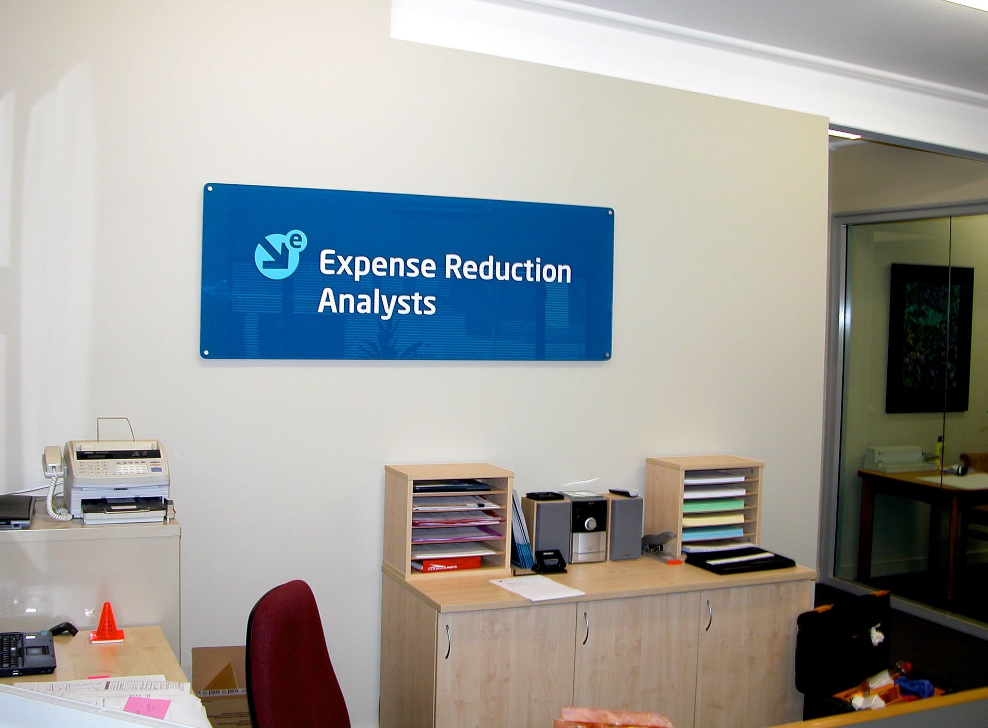 Perspex sign installed on office wall
