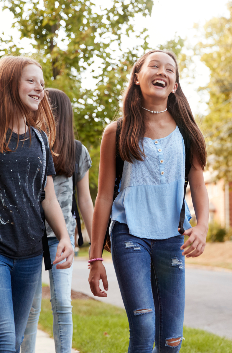 teens walking and smiling