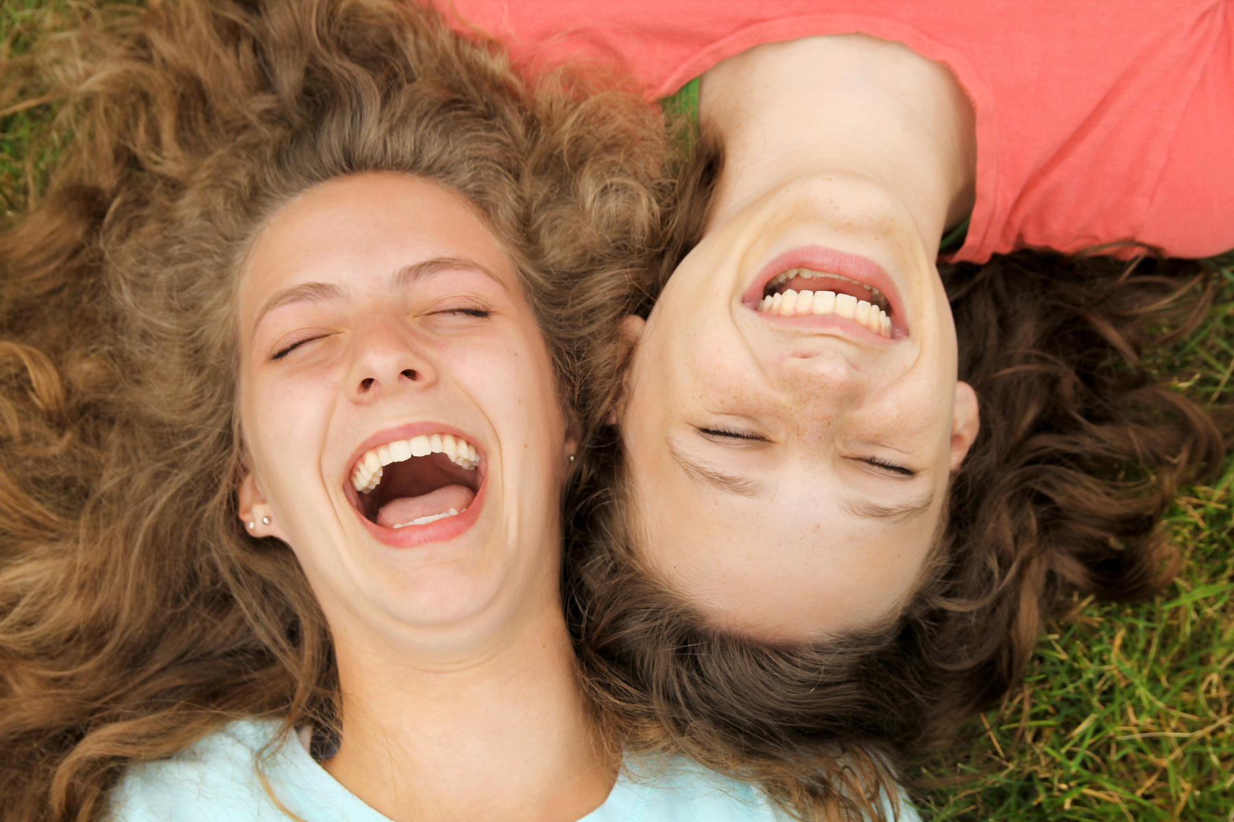 two teens laughing