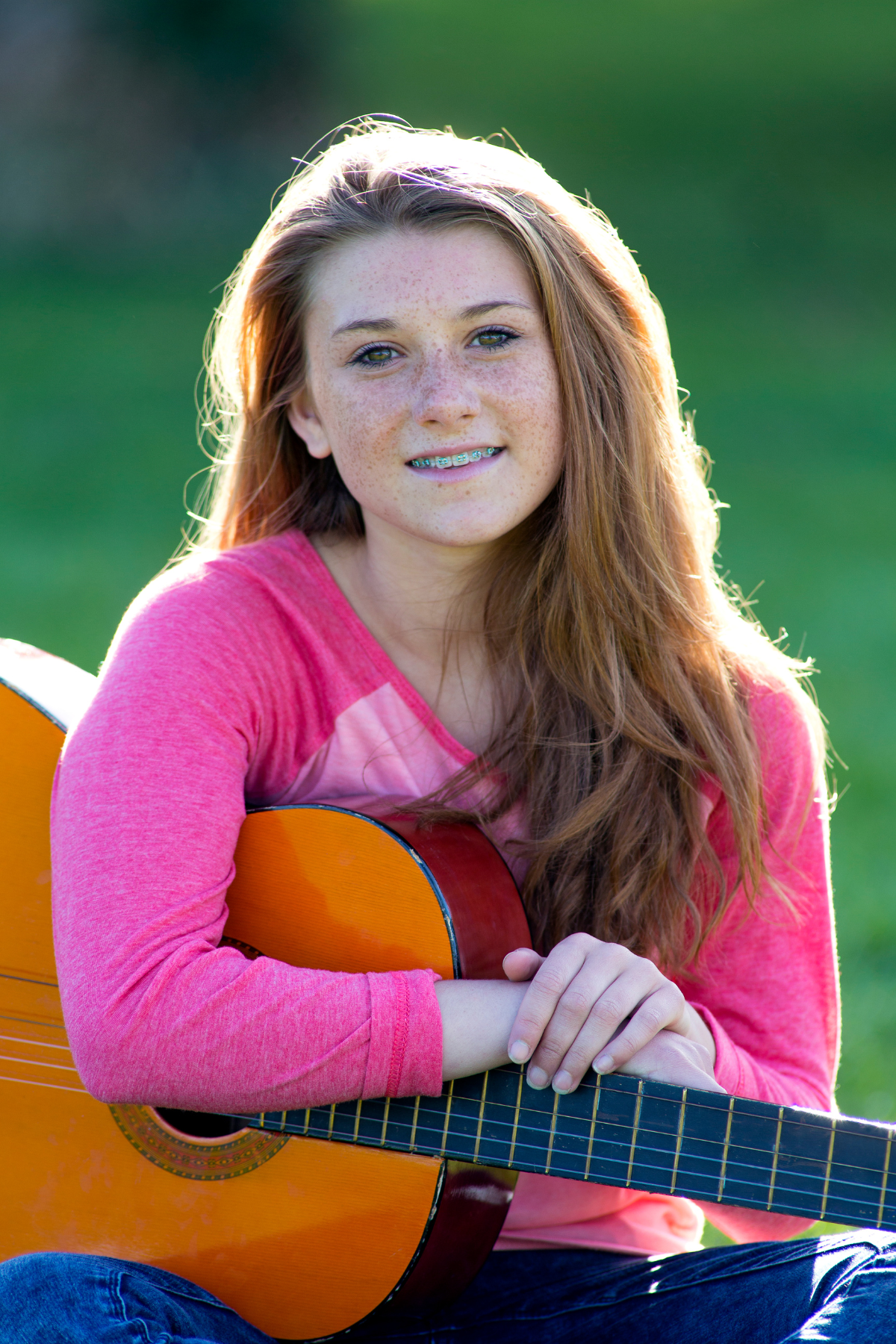 teen playing guitar