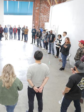 Big group circle of engineers at a soft skills leadership training from Roya Dedeaux