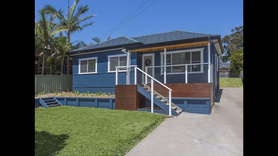 A Blue House With Stairs Leading Up to the Front Door — Karl Witt Painter & Decorator In Albion Park, NSW