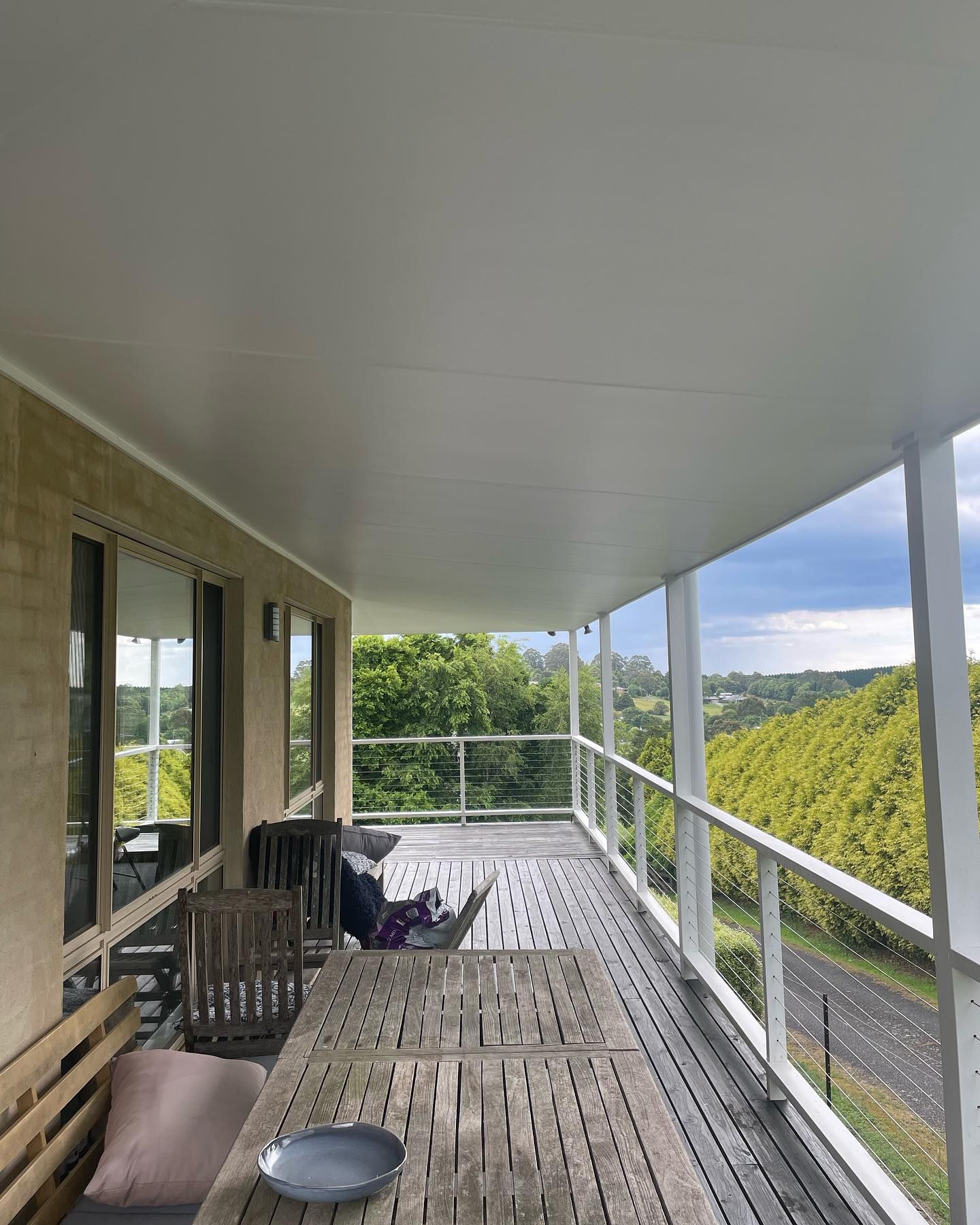 There is a Large Porch With a Table and Chairs — Karl Witt Painter & Decorator In Albion Park, NSW