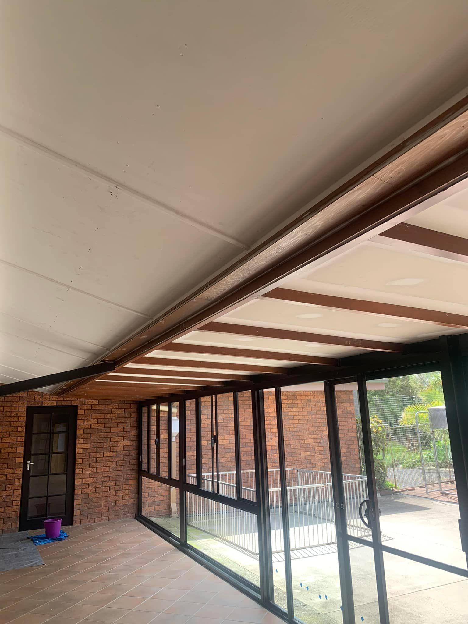 A Room With a Lot of Windows and a Brick Wall — Karl Witt Painter & Decorator In Albion Park, NSW