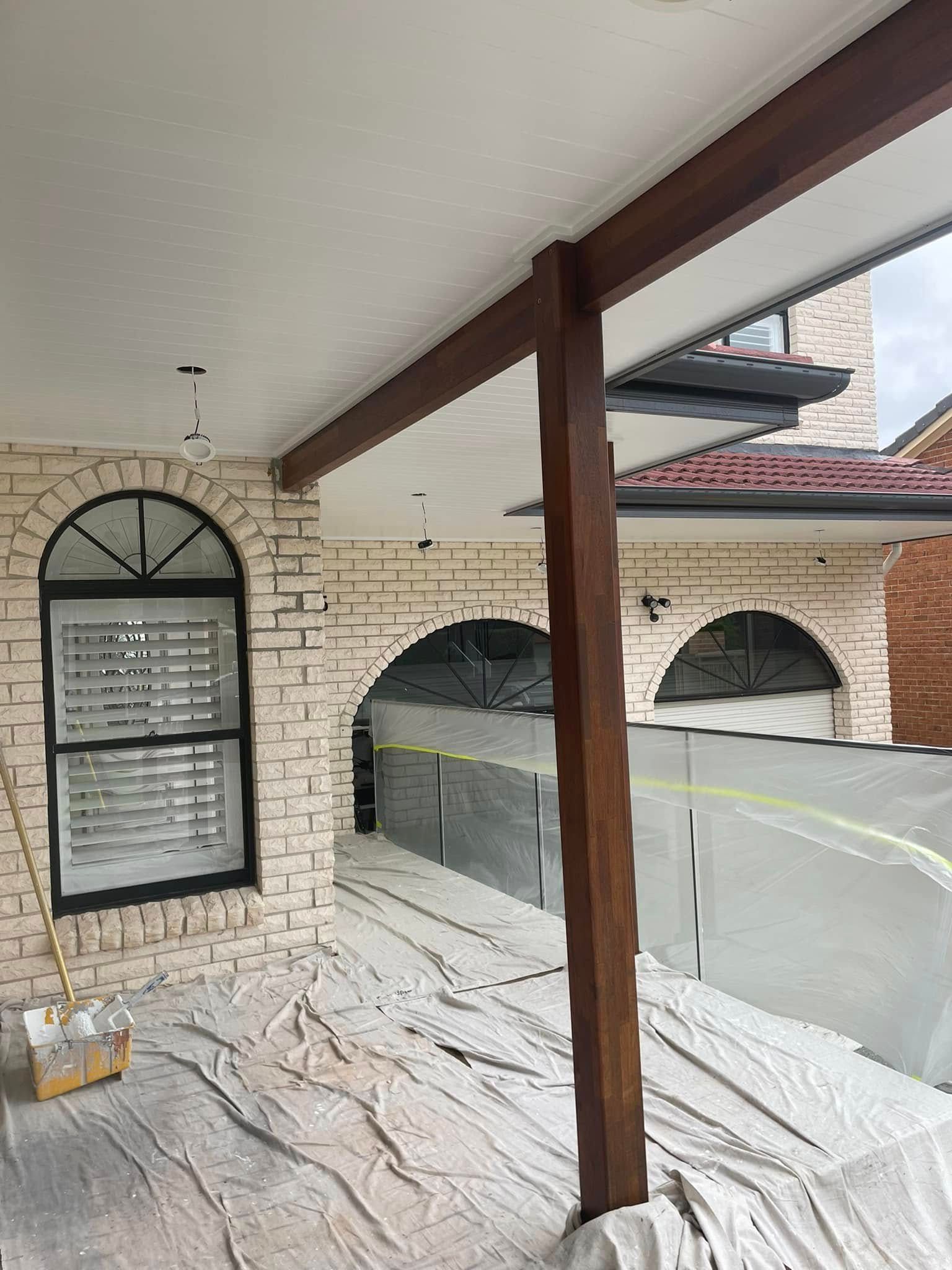 A Brick House With a Covered Porch and a Window — Karl Witt Painter & Decorator In Albion Park, NSW