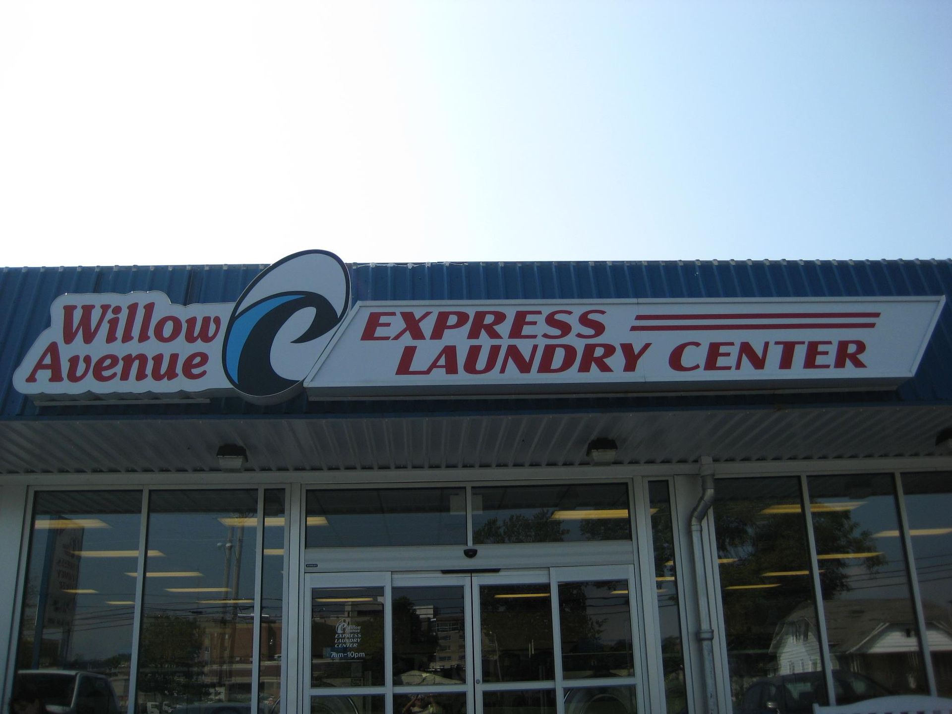 A laundromat with lots of washers and dryers