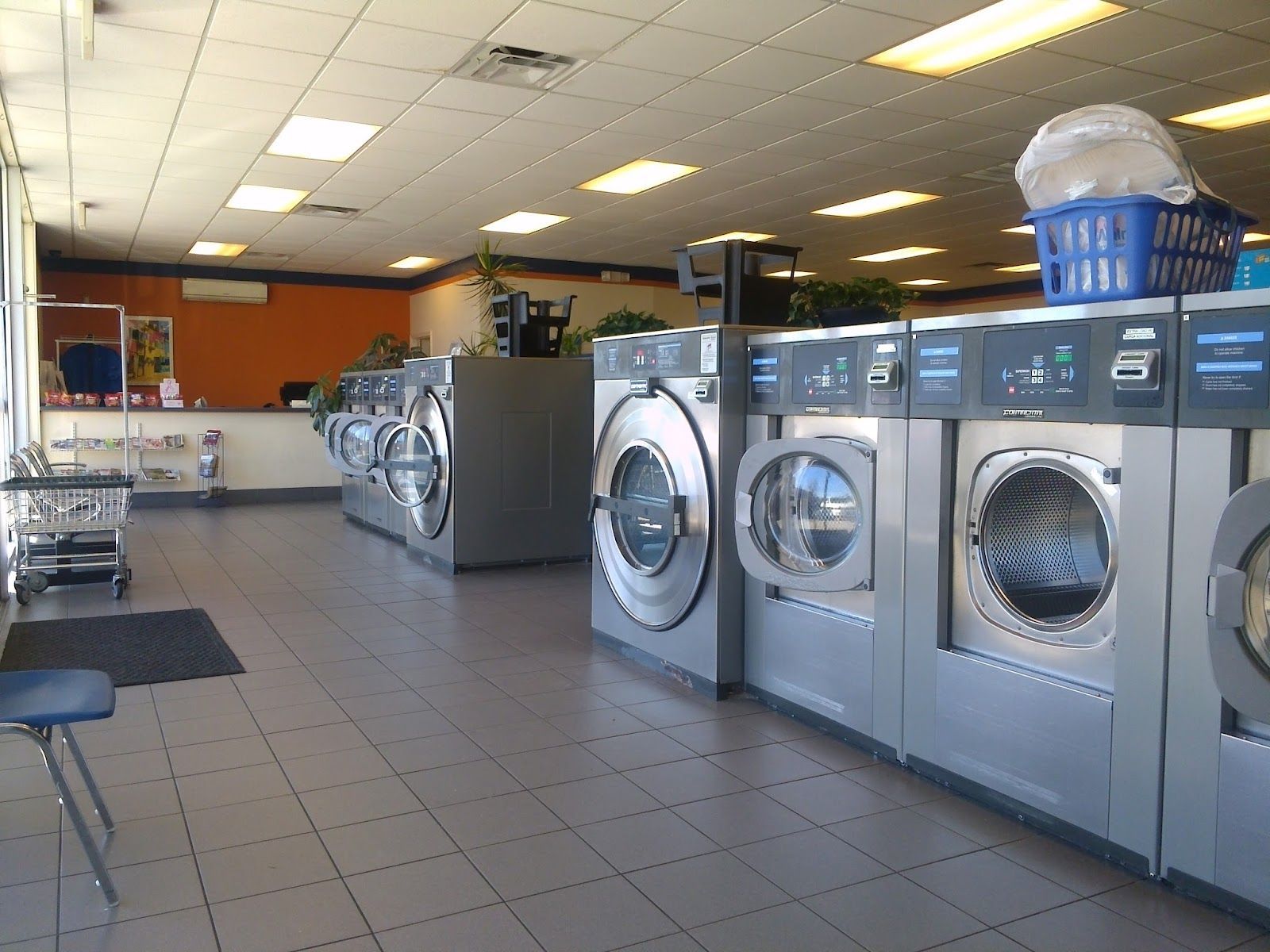 A laundromat with a lot of washers and dryers