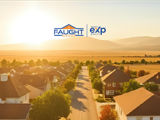 An aerial view of a residential neighborhood with a sunset in the background.