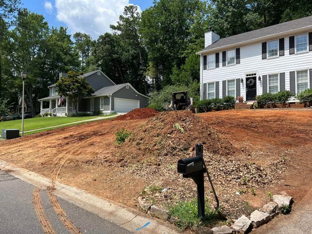 A white house with a mailbox in front of it