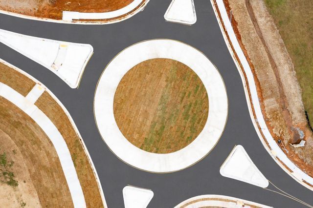 An aerial view of a roundabout with a white circle in the middle