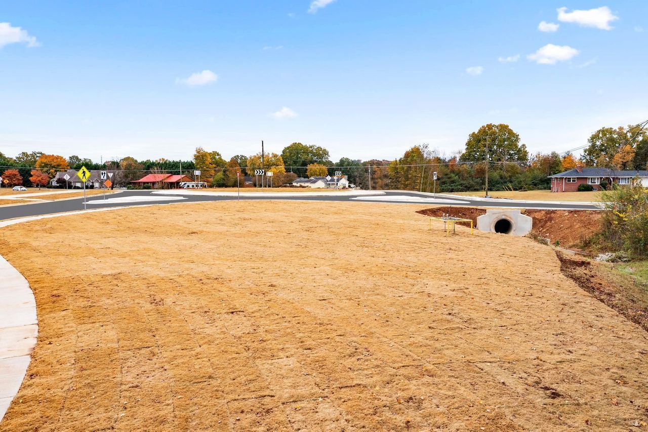 There is a lot of dirt in the middle of the field.