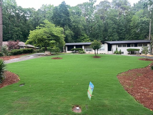 A large house with a mailbox in front of it.