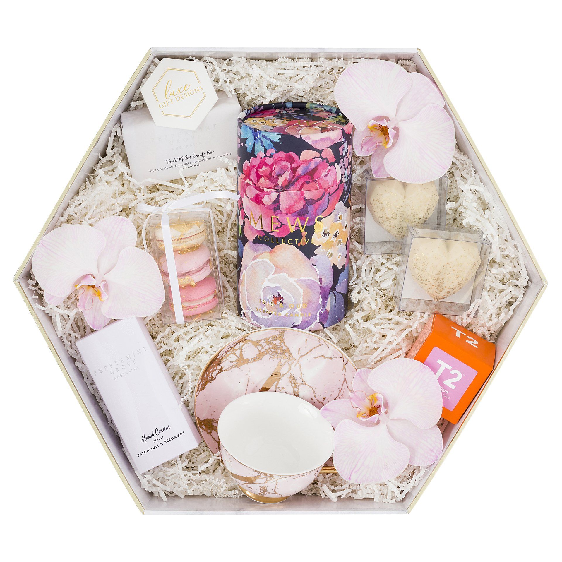 White box with mews collective, hand cream, soap and macaron.