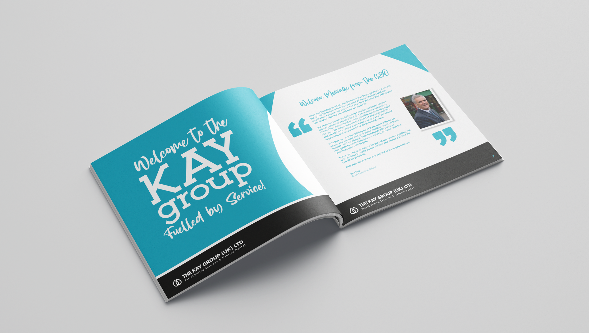 Open magazine spread with teal cover and white text on a light gray background