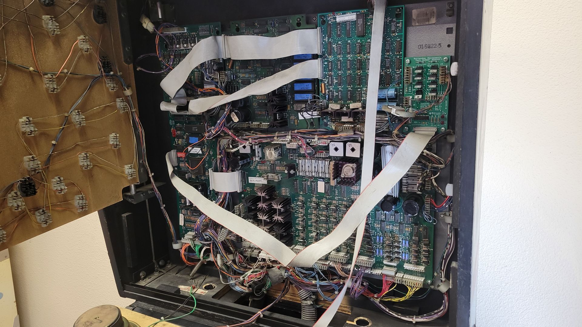 A motherboard with a lot of wires coming out of it