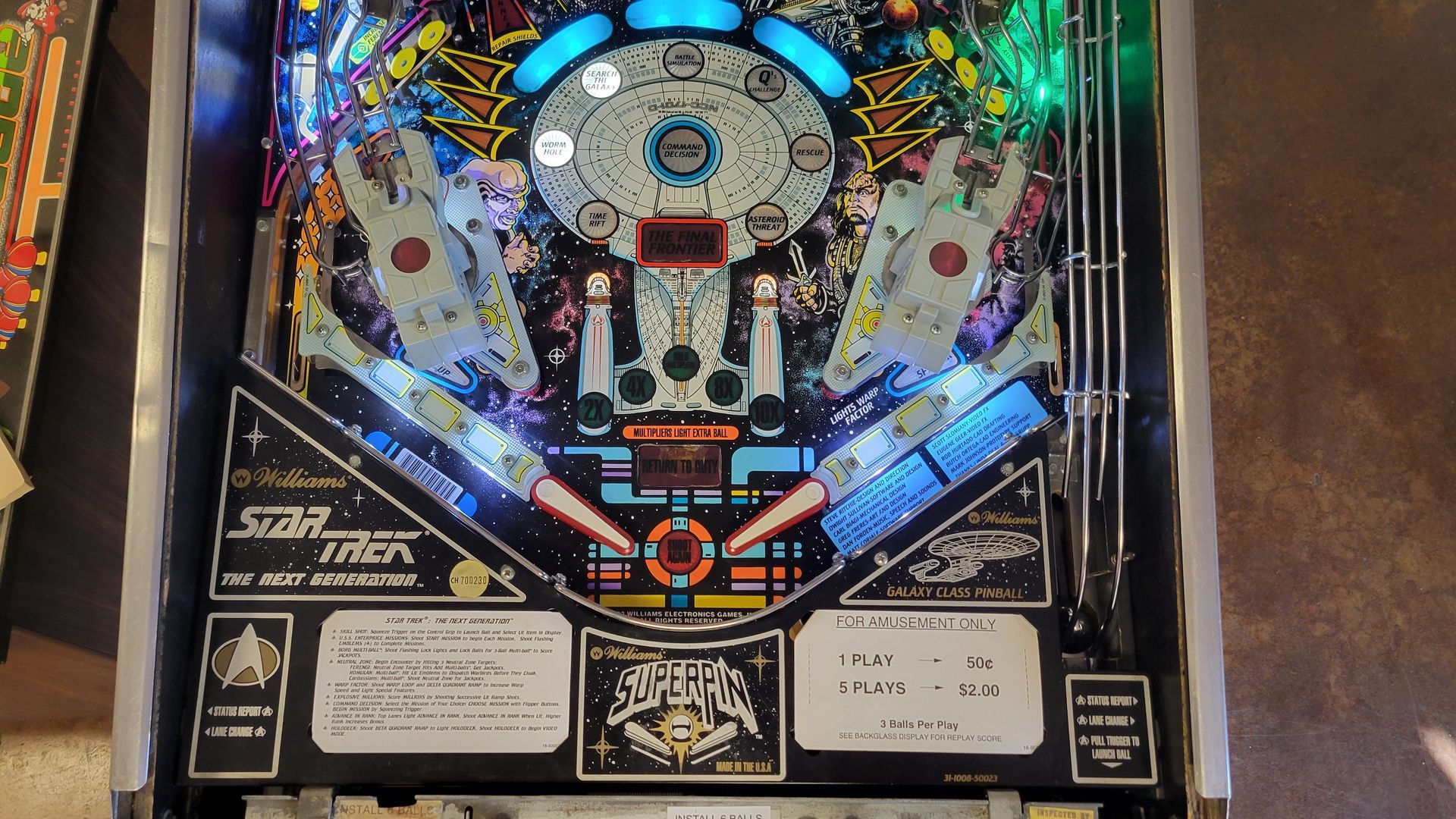 A star trek pinball machine is sitting on a table
