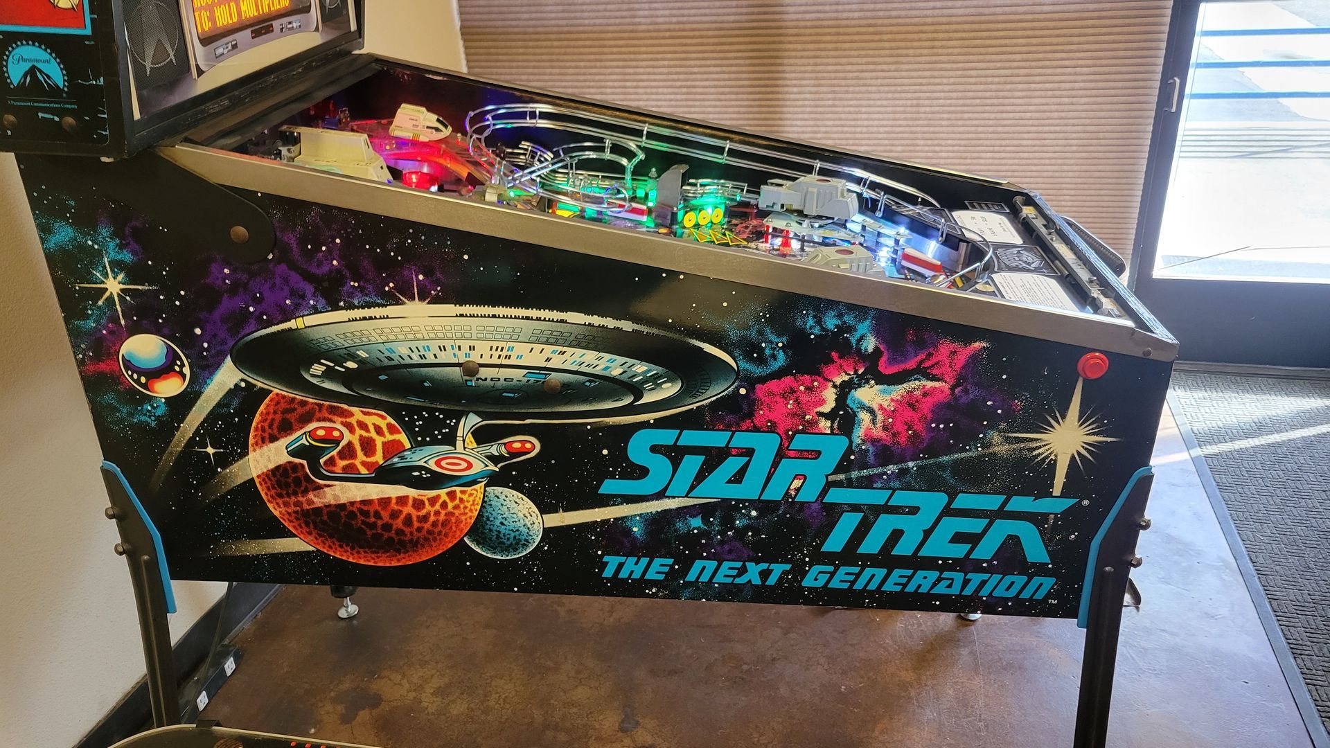 A star trek pinball machine is sitting on a table