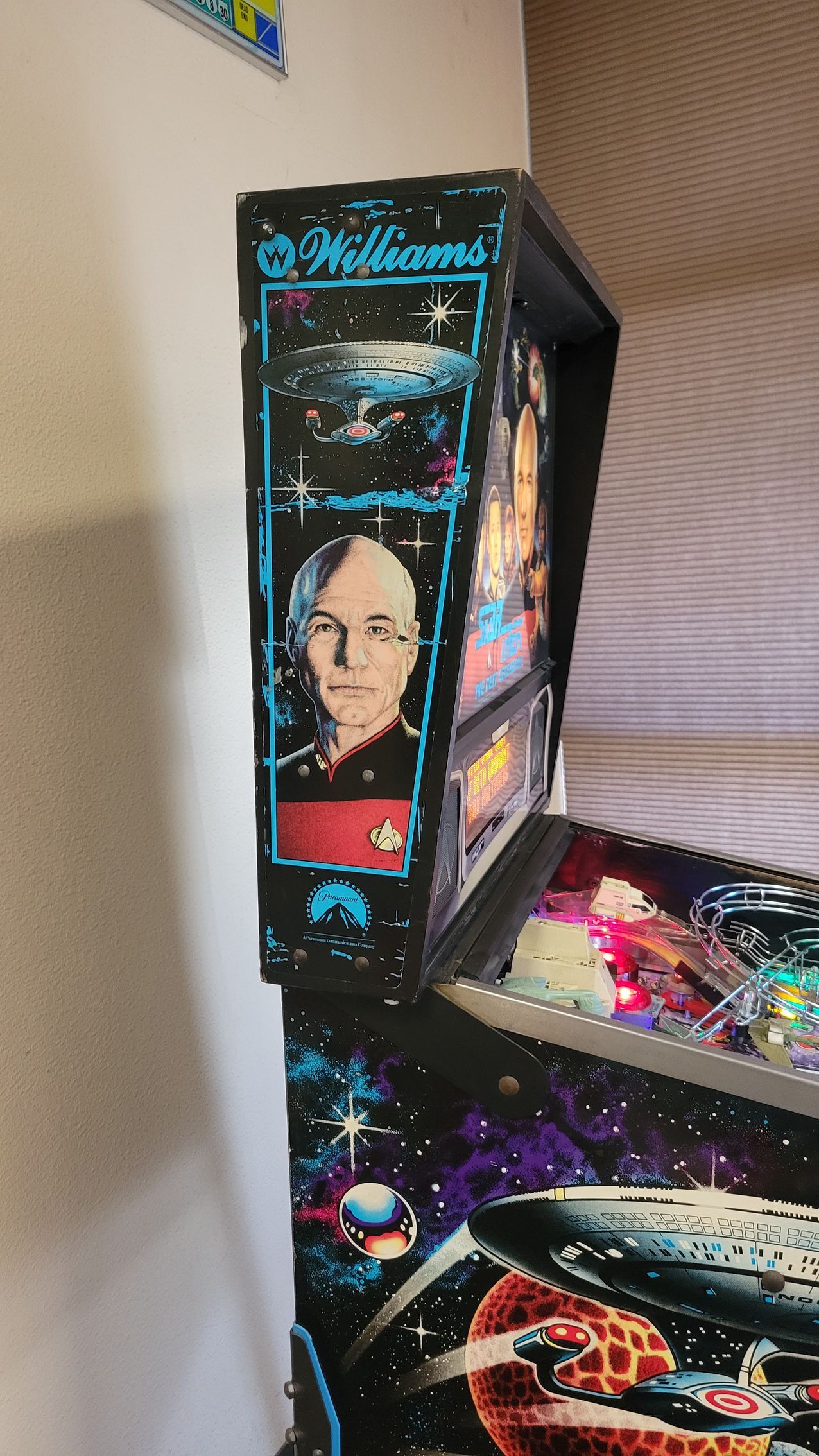 A pinball machine with a picture of a man on it.