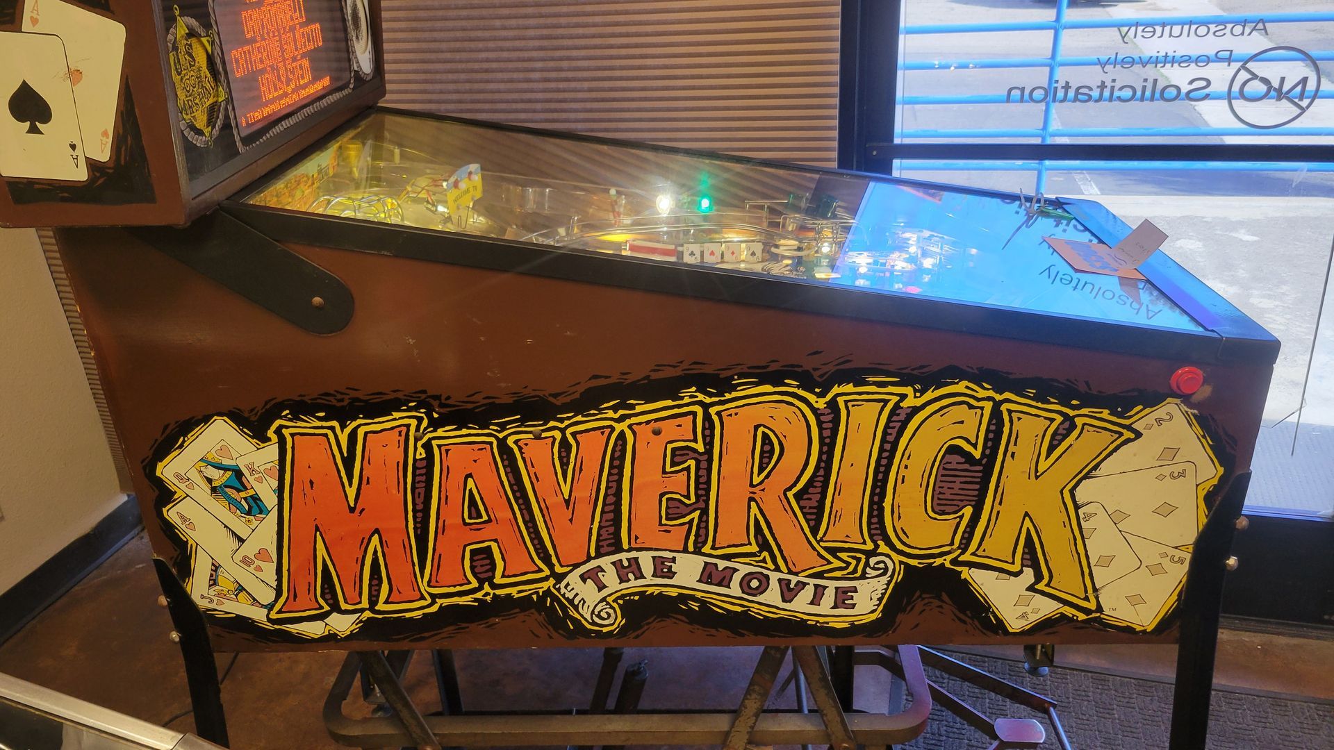 A pinball machine with the word maverick on it