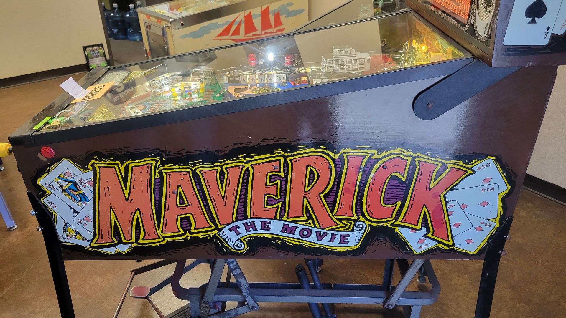 A pinball machine with the word maverick on it