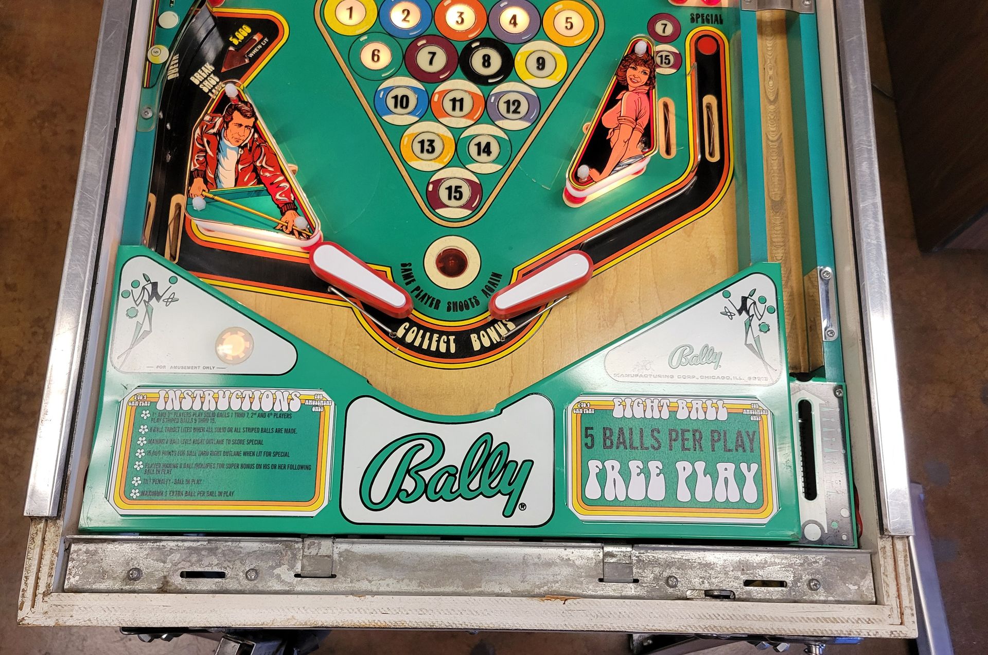 A pinball machine that says bally on it