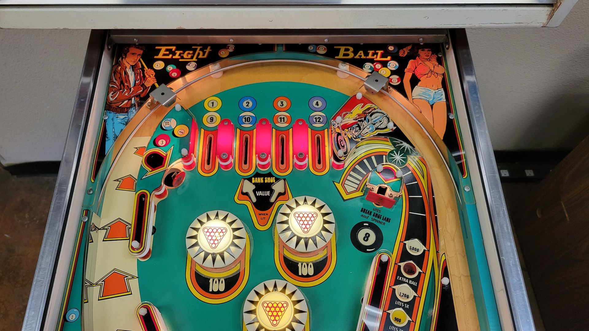A pinball machine with the word ball on it