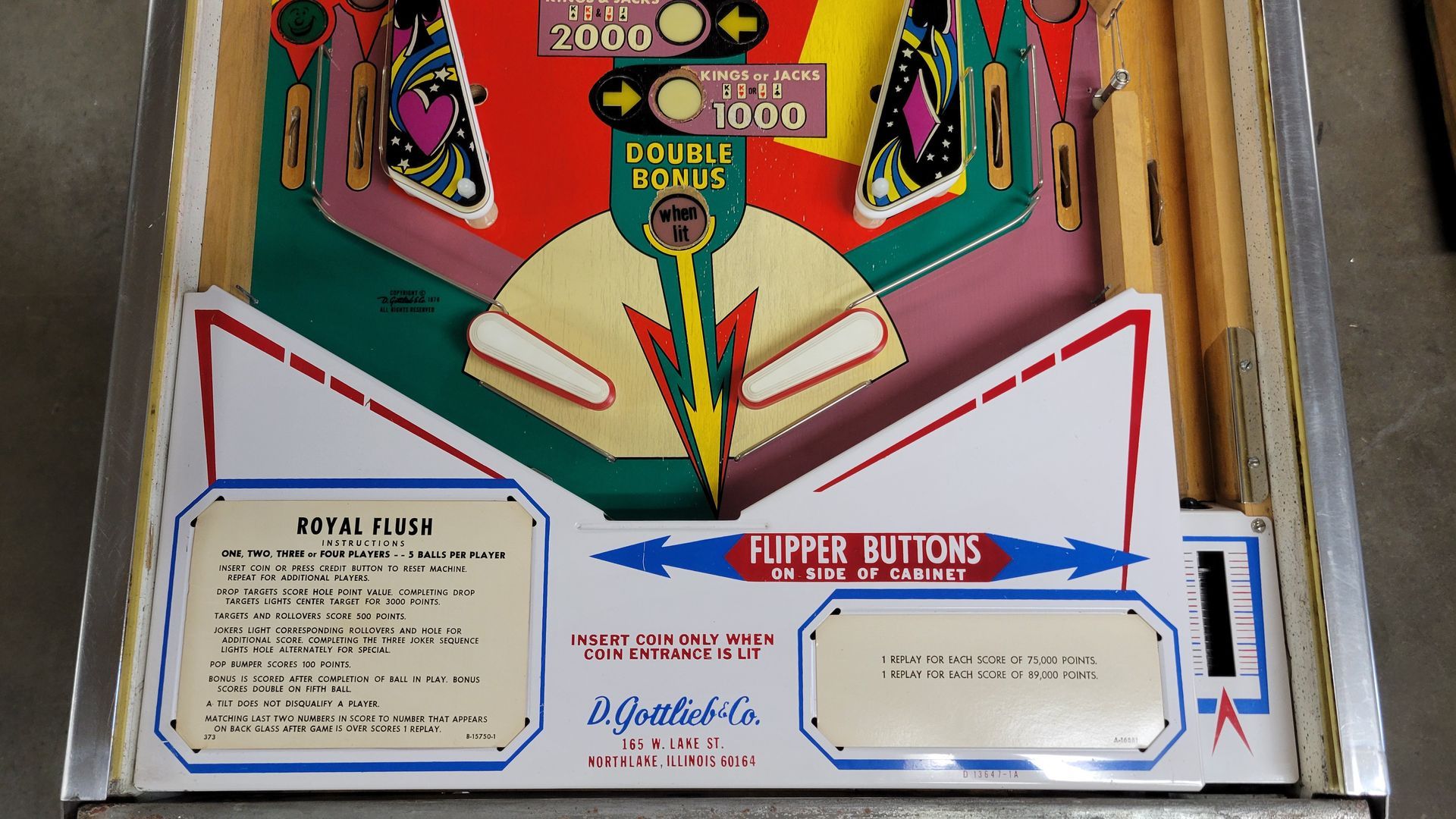 A close up of a pinball machine that says flipper buttons