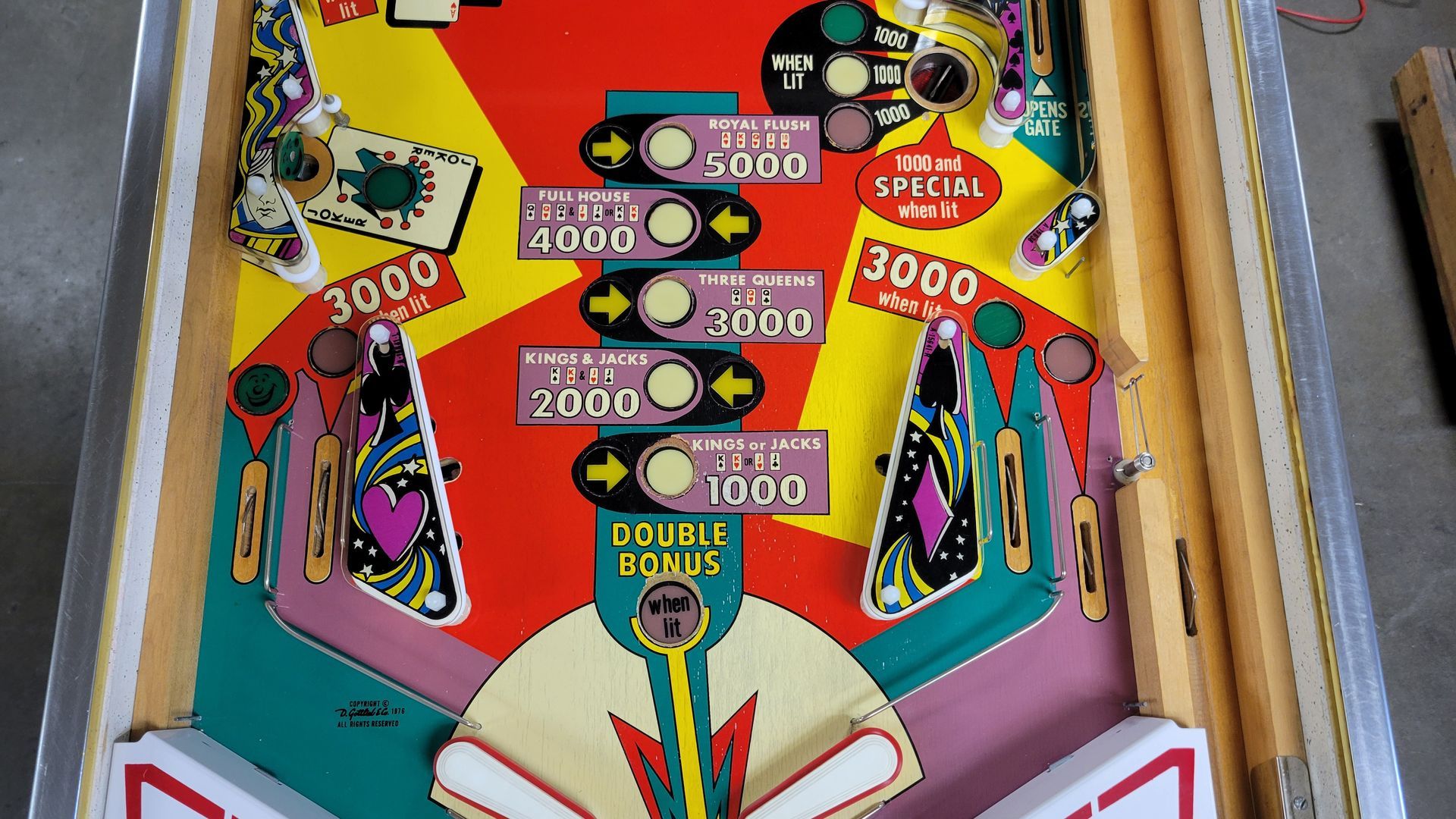 A close up of a pinball machine that says 3000 on it