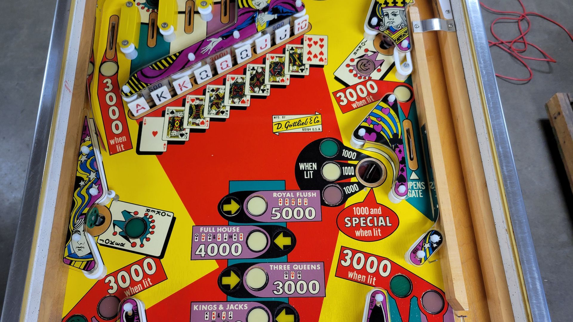 A close up of a pinball machine that says 3000 on it