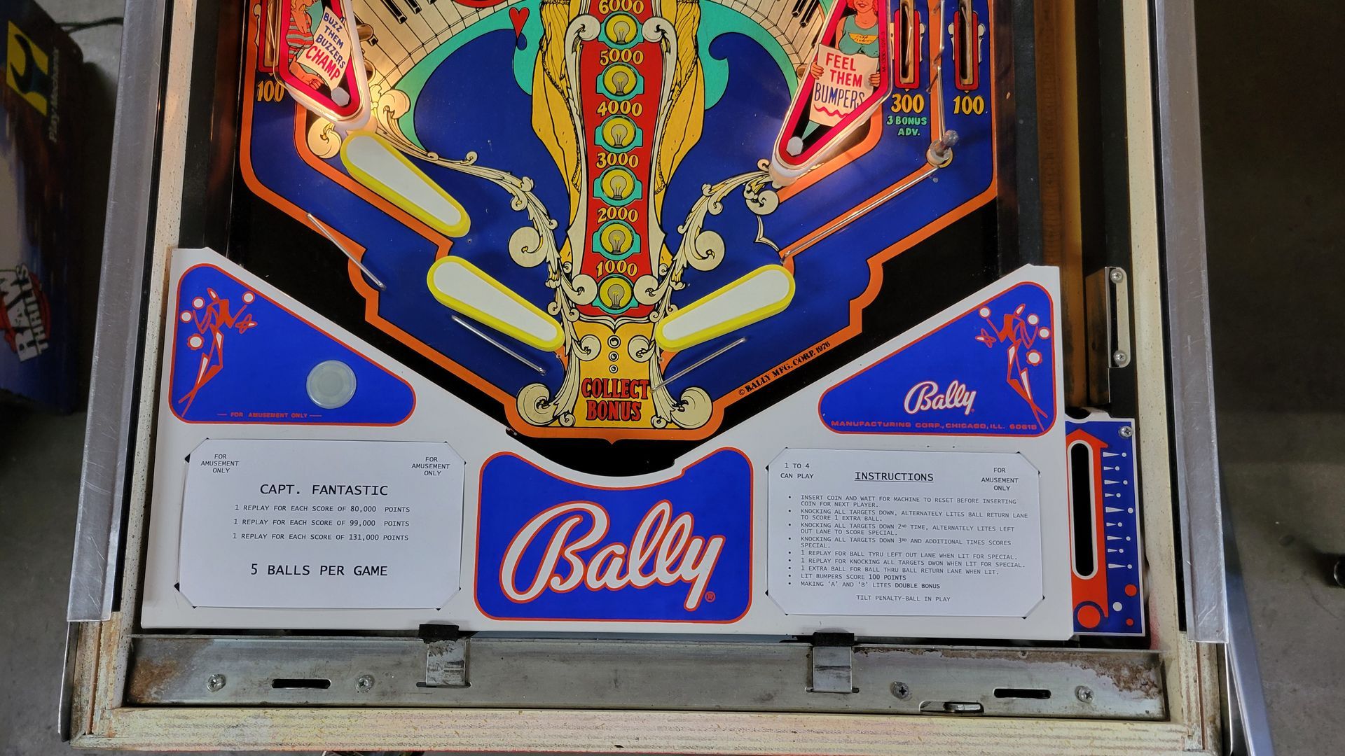 A pinball machine with the word bally on it