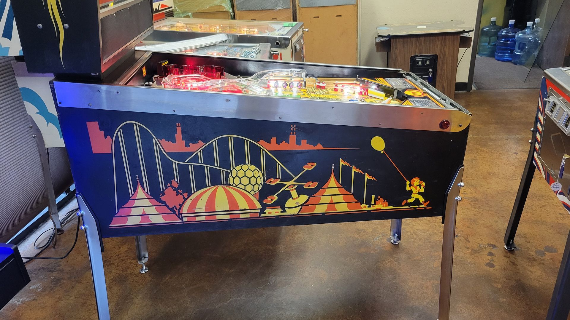 A pinball machine with a carnival theme on it