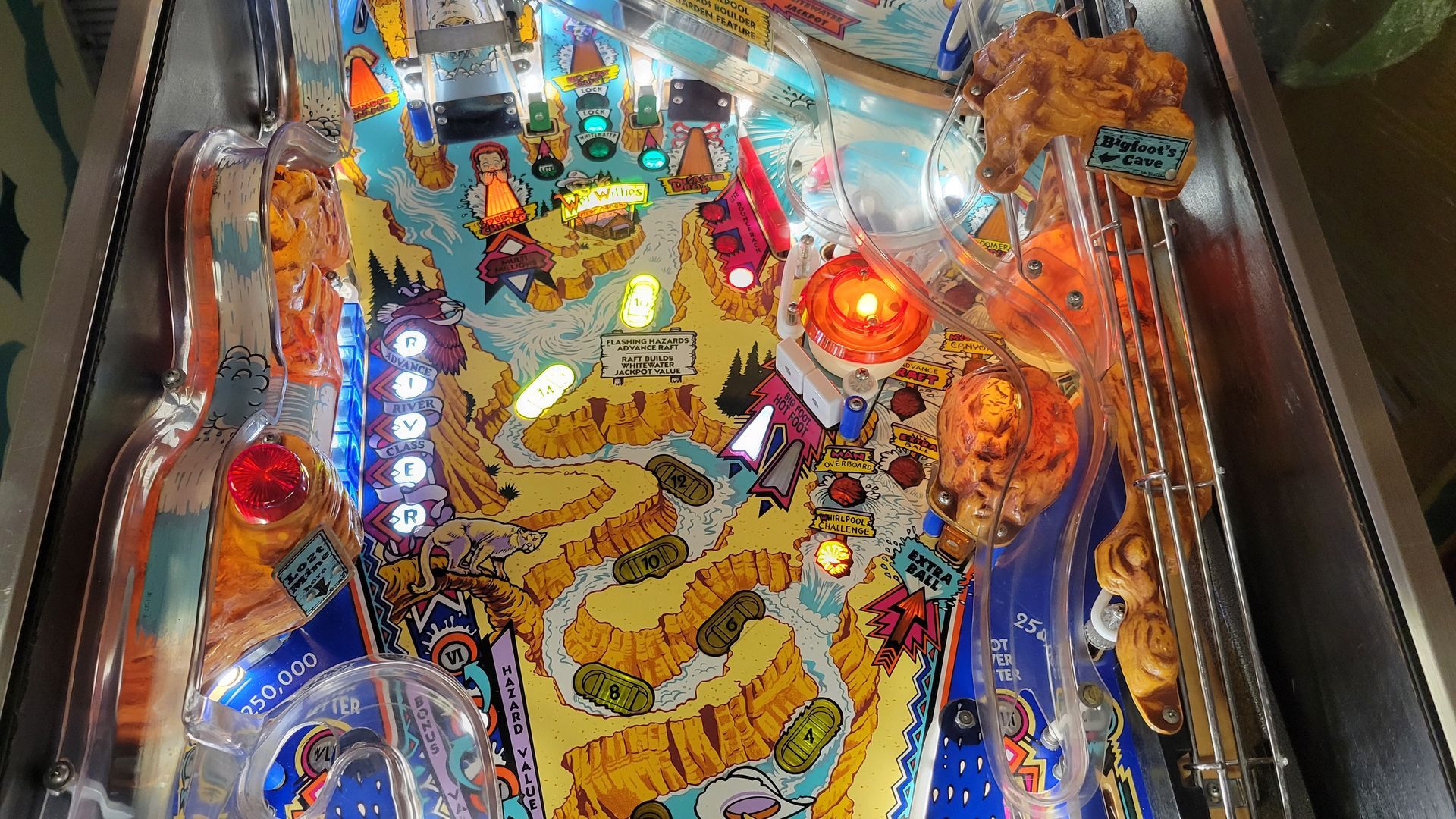 A pinball machine with a lot of lights on it.
