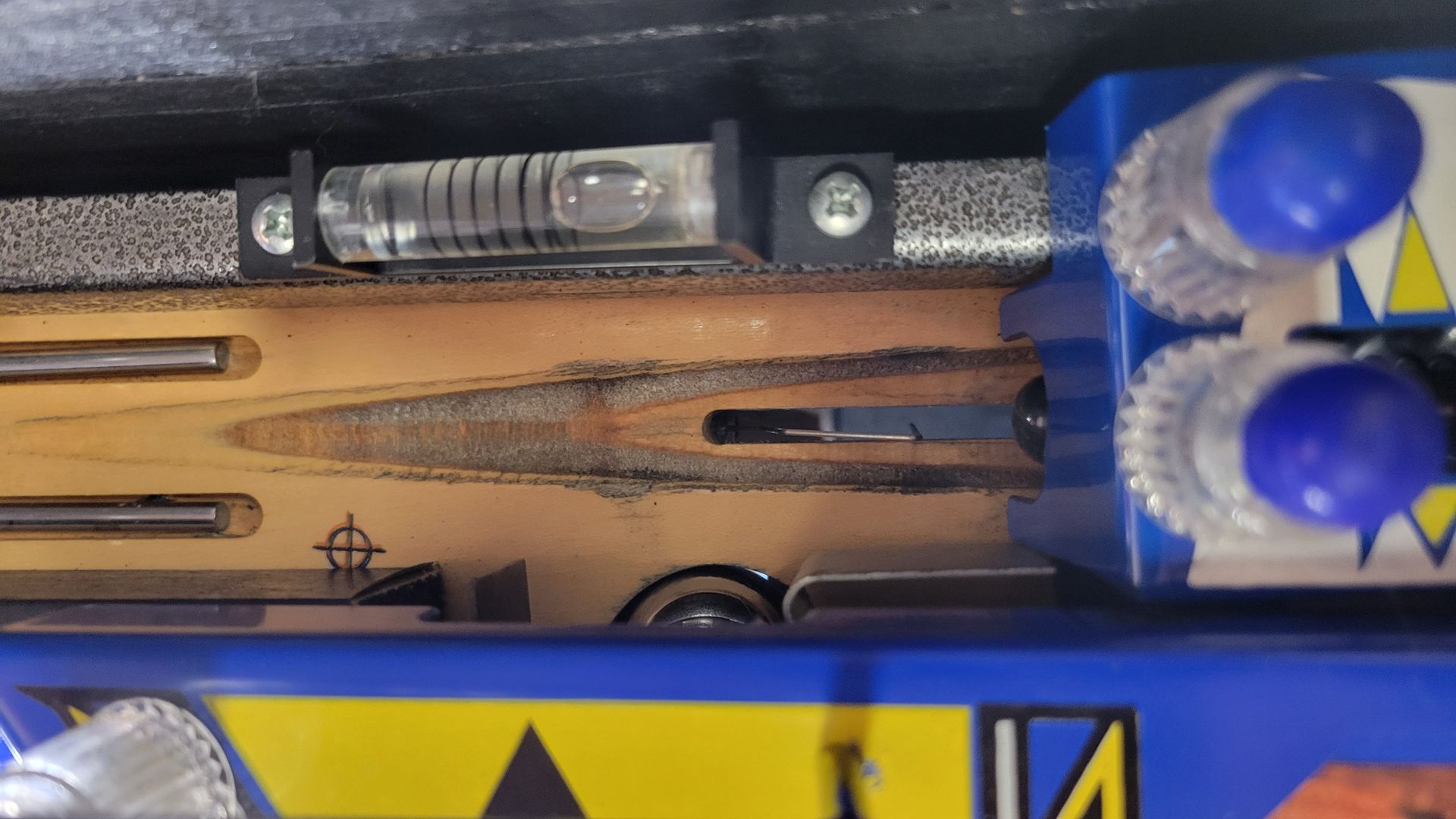 A close up of a blue box with a yellow triangle on it