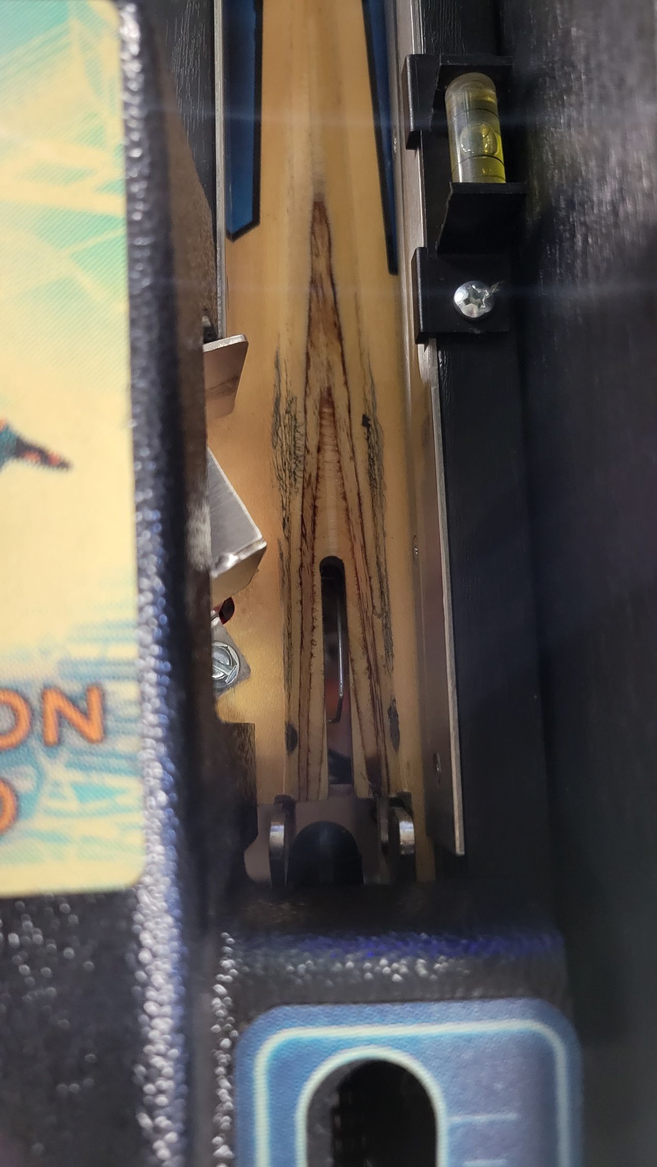 A close up of a piece of wood with a hole in it.