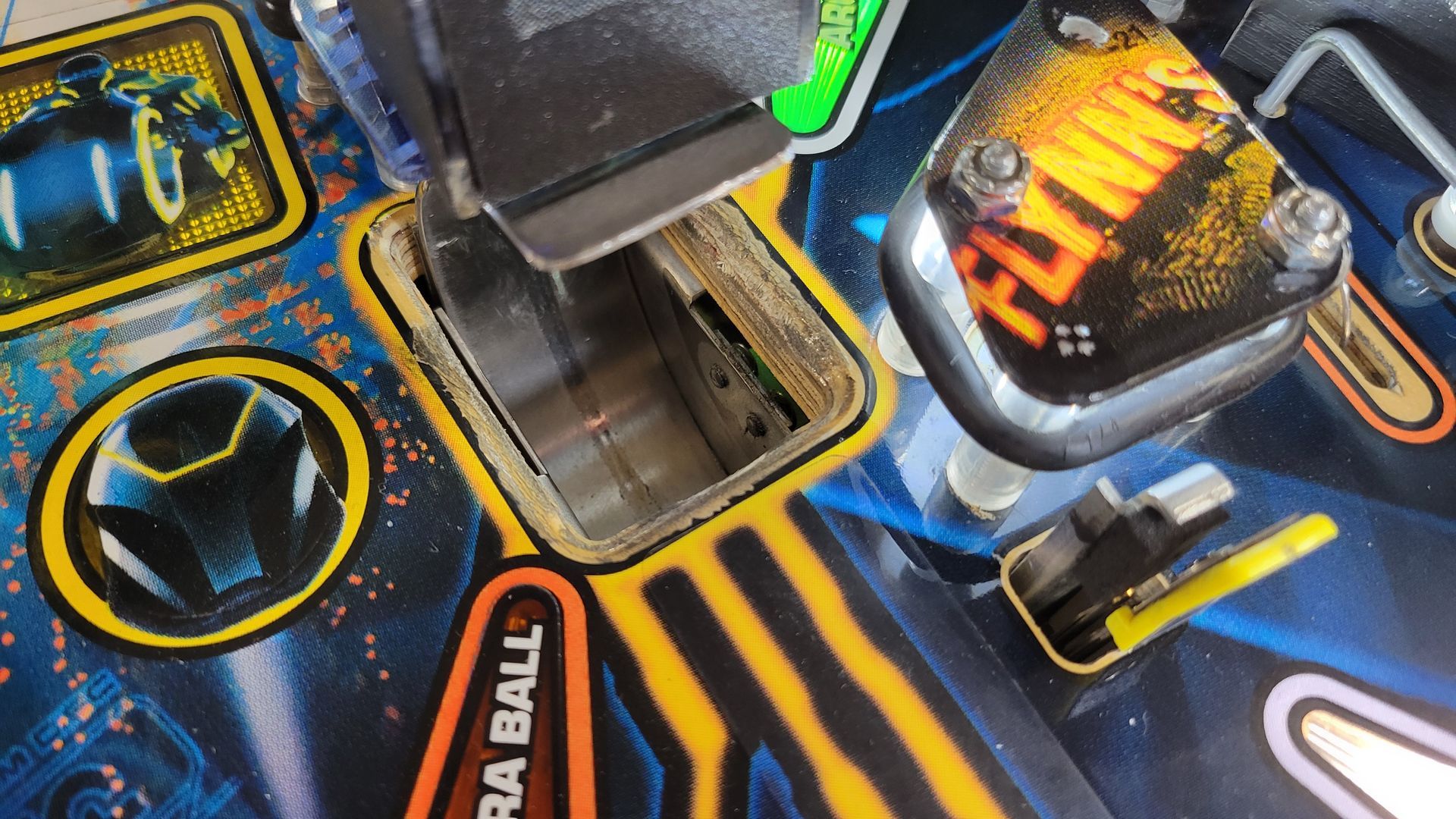 A close up of a pinball machine that says flying