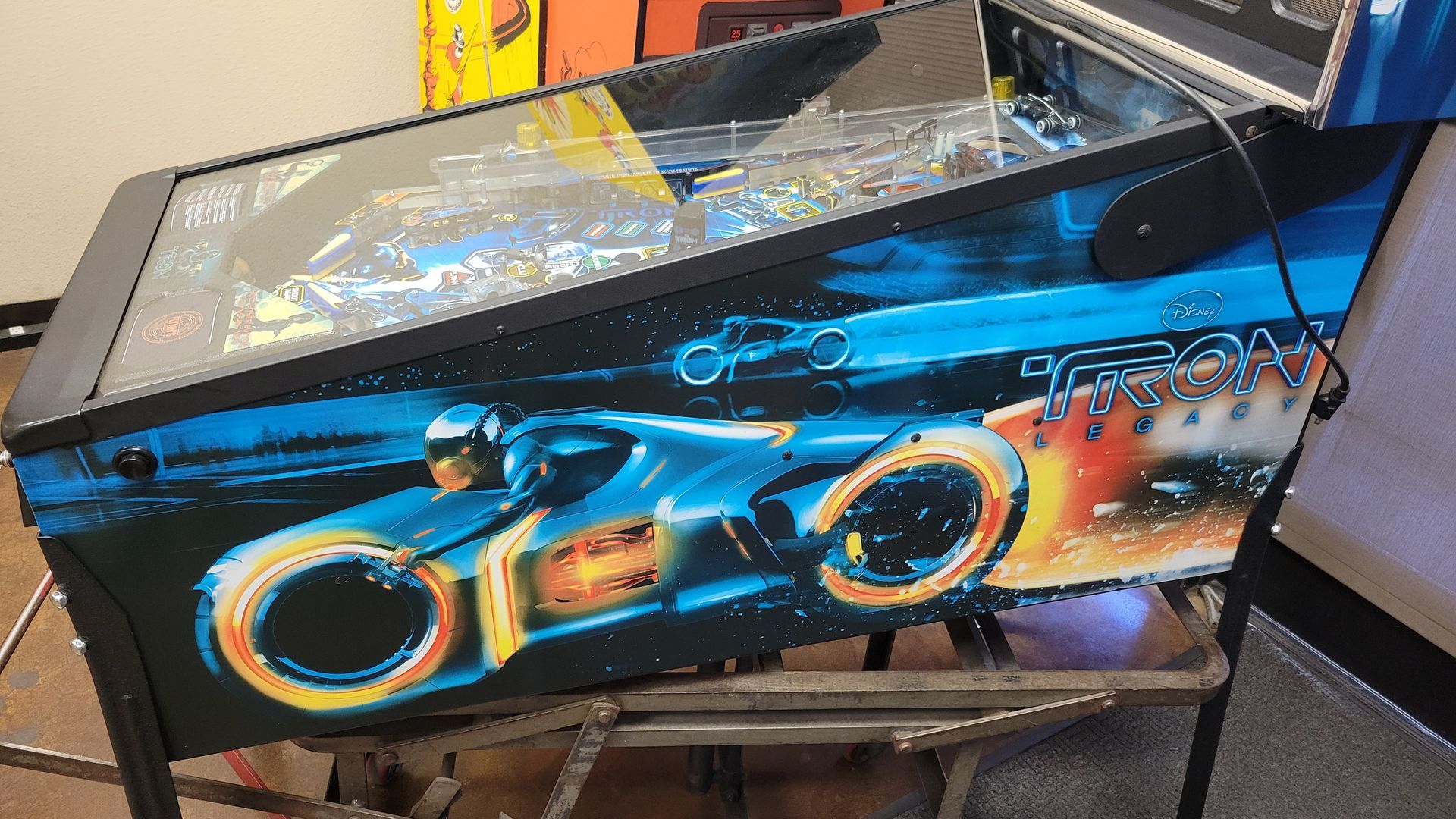 A pinball machine that says tron on it
