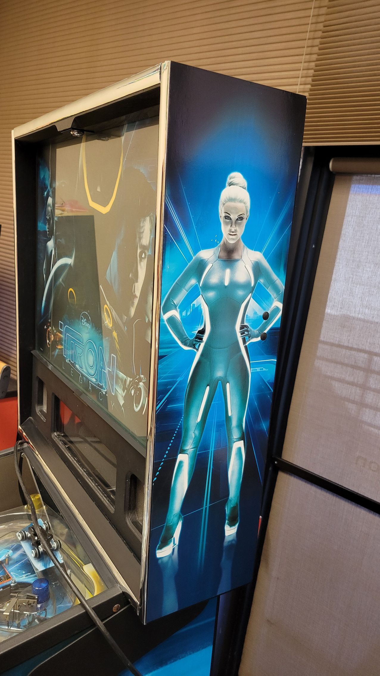 A pinball machine with a picture of a woman on it.
