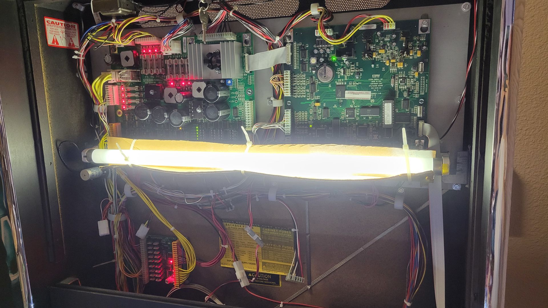A computer motherboard with a light on top of it.