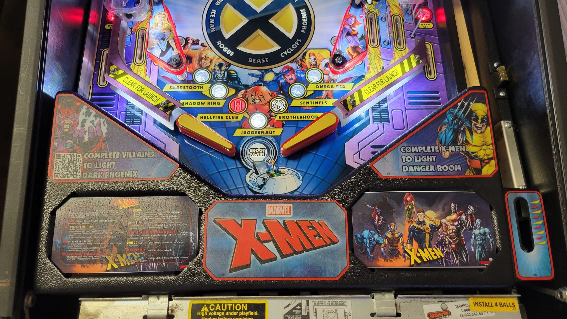A pinball machine with the word x-men on it