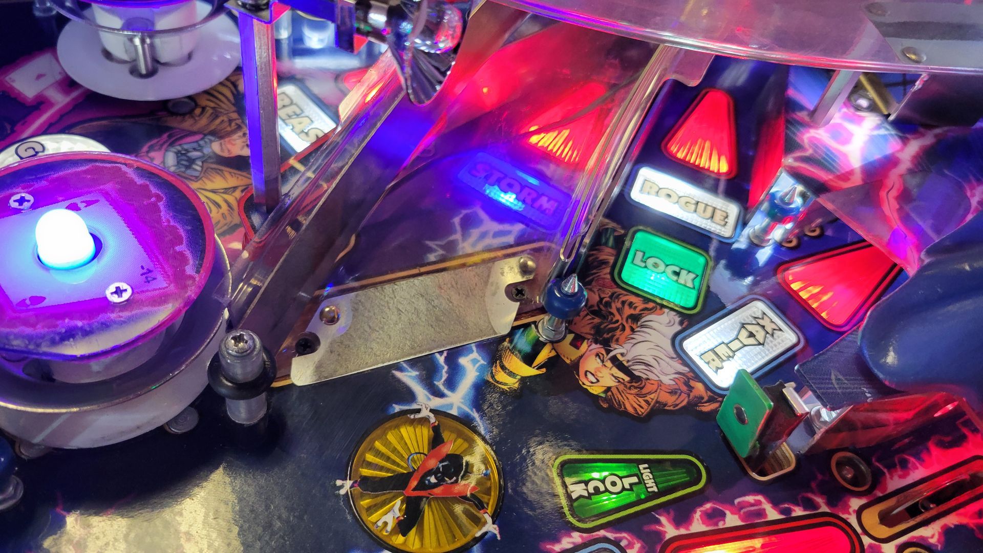 A close up of a pinball machine with a lot of lights on it.